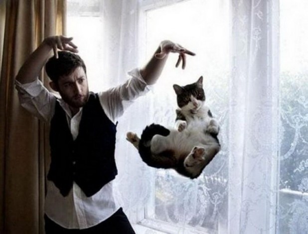 mysterious-man-magician-levitates-cat