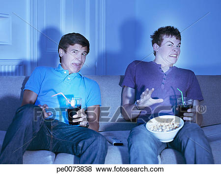 teenage-boys-watching-scary-movie-stock-photo__pe0073838
